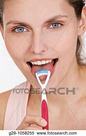 young woman using a tongue grater View Large Photo Image Stock Photography - young woman using a tongue grater. Fotosearch