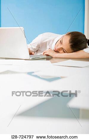 Stock Photo - young woman using computer. Fotosearch