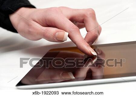 Young woman using ipad tablet computer View Large Photo Image Stock Image - Young woman using ipad tablet computer. Fotosearch