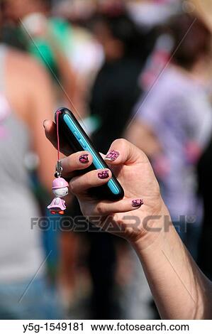 young woman using mobile cell phone in city town View Large Photo Image Stock Image - young woman using mobile cell phone in city town. Fotosearch
