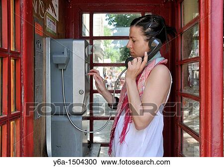 Young woman using public telephone, Vienna, Austria View Large Photo Image Stock Image - Young woman using public telephone, Vienna, Austria. Fotosearch