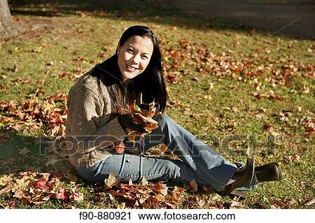 Young woman w autumn leaves MR View Large Photo Image Stock Image - Young woman w autumn leaves MR. Fotosearch