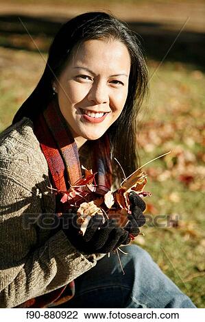 Young woman w autumn leaves MR View Large Photo Image Stock Image - Young woman w autumn leaves MR. Fotosearch