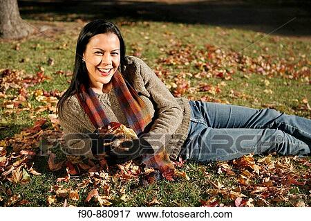 Young woman w autumn leaves MR View Large Photo Image Stock Photo - Young woman w autumn leaves MR. Fotosearch