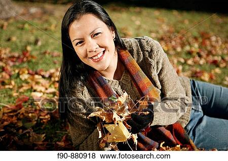 Young woman w autumn leaves MR View Large Photo Image Stock Photo - Young woman w autumn leaves MR. Fotosearch