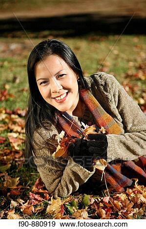 Young woman w autumn leaves MR View Large Photo Image Stock Photo - Young woman w autumn leaves MR. Fotosearch