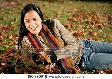 Young woman w autumn leaves MR View Large Photo Image Stock Photograph - Young woman w autumn leaves MR. Fotosearch