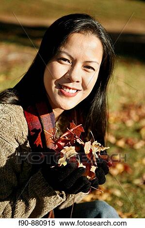 Young woman w autumn leaves MR View Large Photo Image Stock Photography - Young woman w autumn leaves MR. Fotosearch