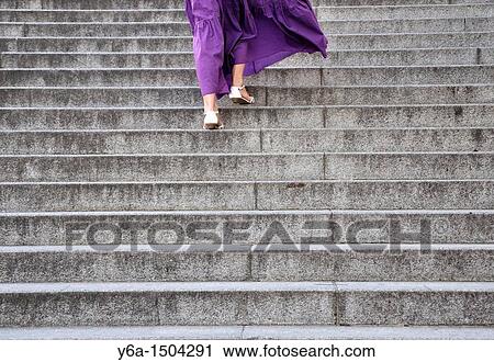 Young woman walking up staircase outdoors rear view View Large Photo Image Stock Image - Young woman walking up staircase outdoors rear view. Fotosearch