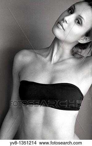 Young woman wearing a bikini top in B&W View Large Photo Image Picture - Young woman wearing a bikini top in B&W. Fotosearch