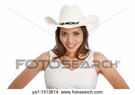 Picture - young woman wearing a cowboy hat. Fotosearch