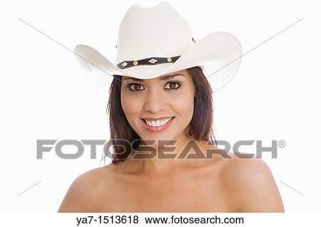 Stock Photo - young woman wearing a cowboy hat. Fotosearch