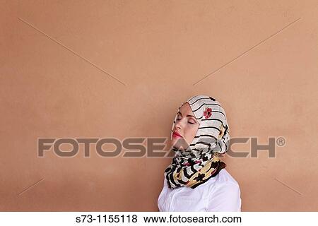 Stock Photo - Young woman wearing a headscarf in Marrakech, Morocco. Fotosearch