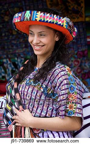 Young woman wearing a? huipil? and a traditional hat, Santiago Atitlan, Solola department, Guatemala View Large Photo Image Stock Photo - Young woman wearing a? huipil? and a traditional hat, Santiago Atitlan, Solola department, Guatemala. Fotosearch