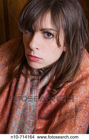 Young woman wearing a long scarf. View Large Photo Image Picture - Young woman wearing a long scarf.. Fotosearch
