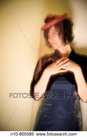 Young woman wearing a red hat with a veil. View Large Photo Image Stock Photo - Young woman wearing a red hat with a veil.. Fotosearch
