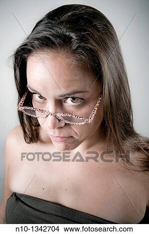 Picture - Young woman wearing glasses. Fotosearch