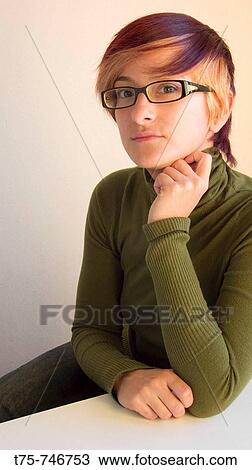 Stock Image - Young woman wearing glasses. Fotosearch