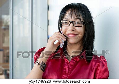 Stock Photograph - Young woman wearing glasses. Fotosearch