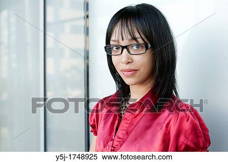 Stock Photography - Young woman wearing glasses. Fotosearch