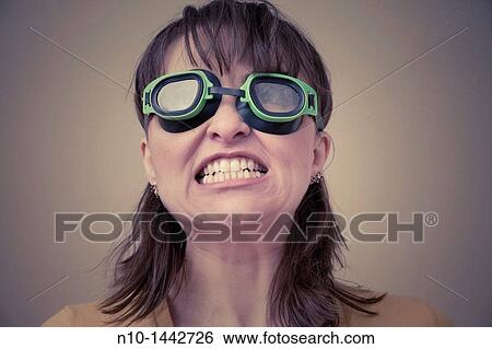 Stock Photograph - Young woman wearing goggles. Fotosearch