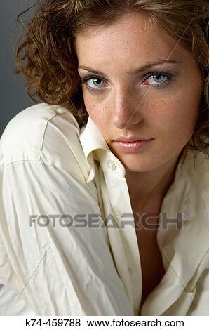 Stock Photo - Young Woman Wearing Man's White Dress Shirt. Fotosearch