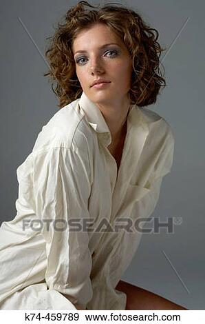 Stock Photo - Young Woman Wearing Man's White Dress Shirt. Fotosearch