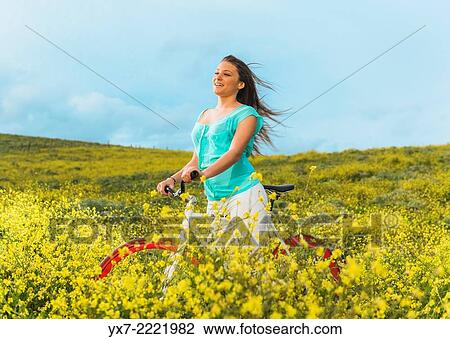 Young woman with a bycicle. Tarifa, Cadiz, Andalusia, Spain, Europe. View Large Photo Image Stock Image - Young woman with a bycicle. Tarifa, Cadiz, Andalusia, Spain, Europe.. Fotosearch