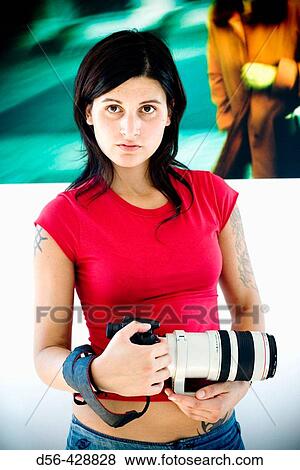 young woman with a camera View Large Photo Image Stock Photo - young woman with a camera. Fotosearch