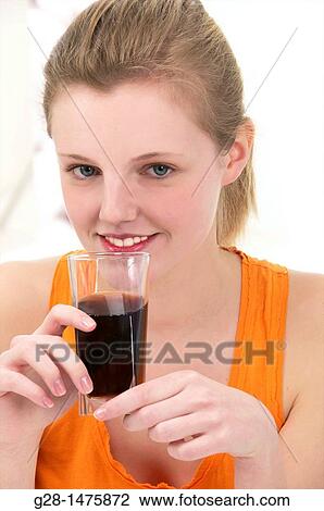 young woman with a glass of coke View Large Photo Image Stock Image - young woman with a glass of coke. Fotosearch