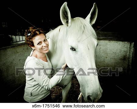 young woman with a horse View Large Photo Image Stock Photograph - young woman with a horse. Fotosearch