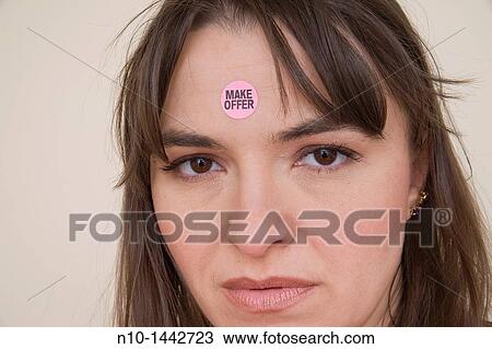 Young woman with a? Make Offer? sticker on her forehead View Large Photo Image Stock Image - Young woman with a? Make Offer? sticker on her forehead. Fotosearch