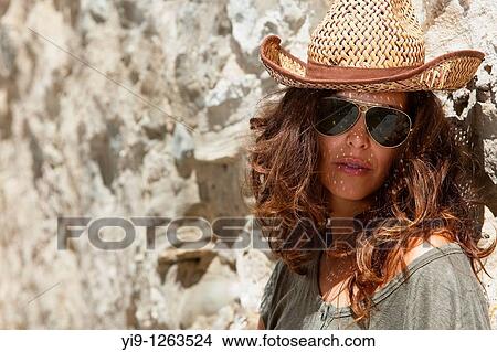 Young woman with a straw hat and sunglasses View Large Photo Image Picture - Young woman with a straw hat and sunglasses. Fotosearch