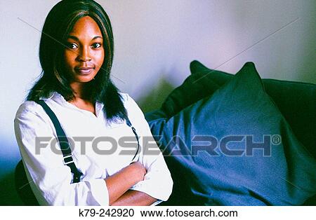 Young woman with arms crossed. View Large Photo Image Stock Image - Young woman with arms crossed.. Fotosearch