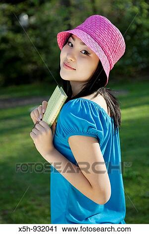 young woman with book outdoor View Large Photo Image Stock Image - young woman with book outdoor. Fotosearch