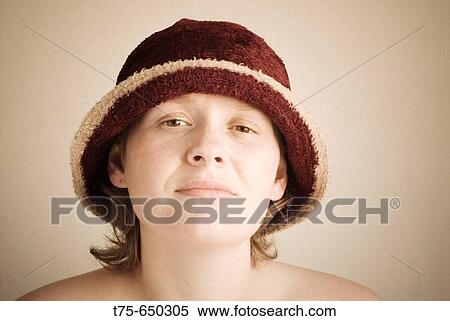 Stock Photography - Young woman with cap. Fotosearch