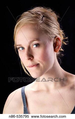 Stock Photography - Young woman with curious look. Fotosearch