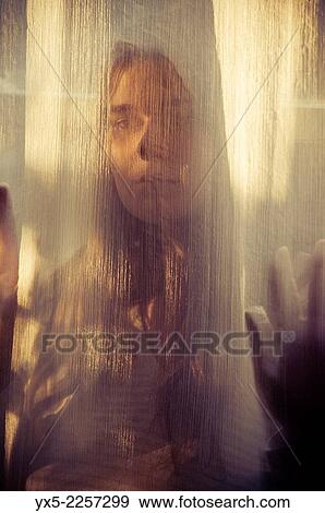 young woman with face obscured by a cloth. View Large Photo Image Stock Photo - young woman with face obscured by a cloth.. Fotosearch