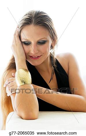 Young woman with gold bracelet and evening dress. Czech Republic. Prague. View Large Photo Image Stock Photography - Young woman with gold bracelet and evening dress. Czech Republic. Prague.. Fotosearch