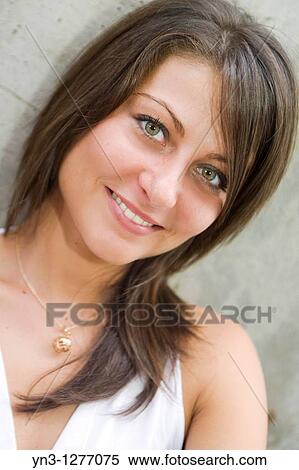 Young woman with green eyes, face closeup View Large Photo Image Stock Photography - Young woman with green eyes, face closeup. Fotosearch