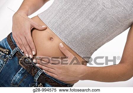 young woman with hands on her stomach to alleviate painclose up View Large Photo Image Stock Photography - young woman with hands on her stomach to alleviate painclose up. Fotosearch