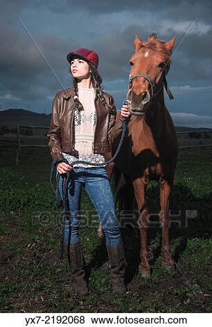 Stock Photo - Young woman with her Horse. Tarifa, cadiz, Andalusia, Spain.. Fotosearch