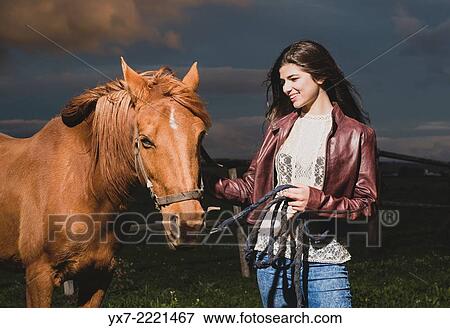 Young woman with her Horse. Tarifa, cadiz, Andalusia, Spain. View Large Photo Image Stock Photo - Young woman with her Horse. Tarifa, cadiz, Andalusia, Spain.. Fotosearch
