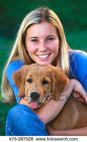 young woman with puppy View Large Photo Image Stock Photo - young woman with puppy. Fotosearch