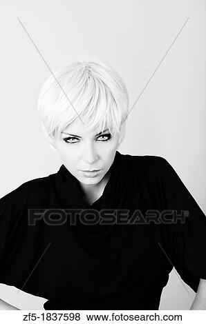 Young woman with short blond hair View Large Photo Image Stock Photo - Young woman with short blond hair. Fotosearch