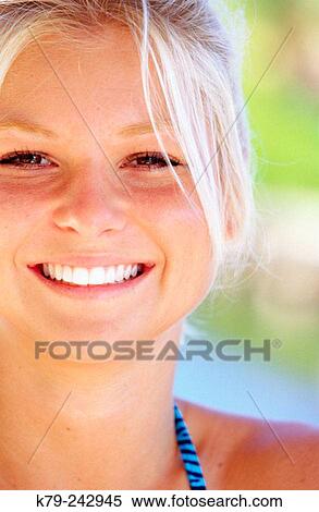 Stock Photography - Young woman with smile. Fotosearch