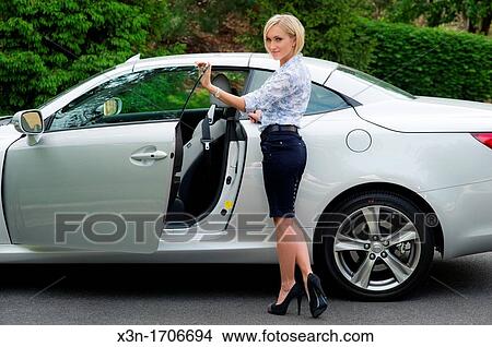 Young woman with sports car View Large Photo Image Picture - Young woman with sports car. Fotosearch