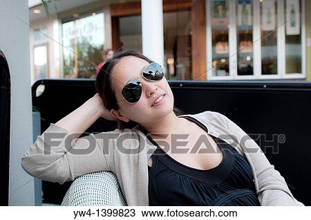 Young woman with sunglasses View Large Photo Image Stock Image - Young woman with sunglasses. Fotosearch