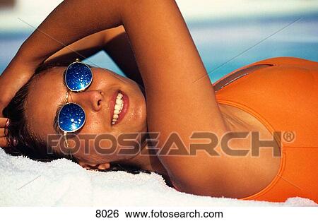 Stock Photograph - Young woman with sunglasses. Fotosearch