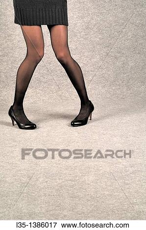 Stock Photo - Young woman with very long legs. Fotosearch